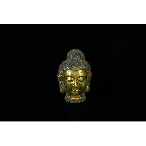 346 - A Chinese Tibetan Gilded Bronze Buddha Head, 19th Century or Later. - A fragmented head, likely repr... 
