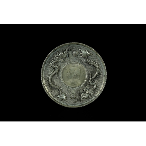 347 - A Chinese White Metal Dragon Plaque with Inset Yuan Shikai Commemorative Coin - A Chinese circular w... 