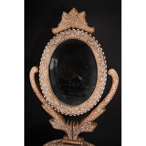 74 - An Indian Wood and Bone Inlaid Dressing Mirror on Stand, 20th Century.

A 20th century Indian carved... 