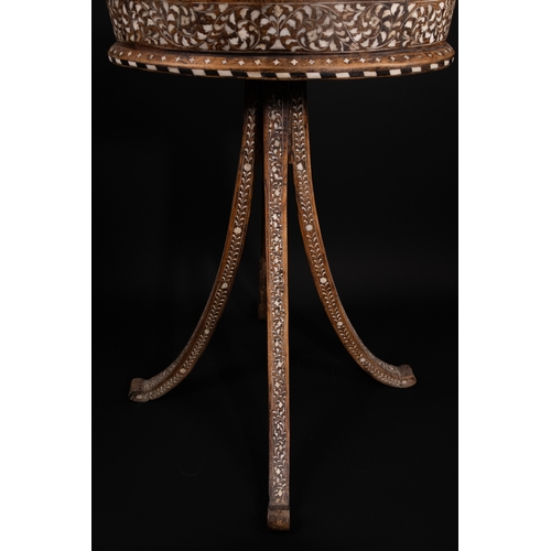 74 - An Indian Wood and Bone Inlaid Dressing Mirror on Stand, 20th Century.

A 20th century Indian carved... 