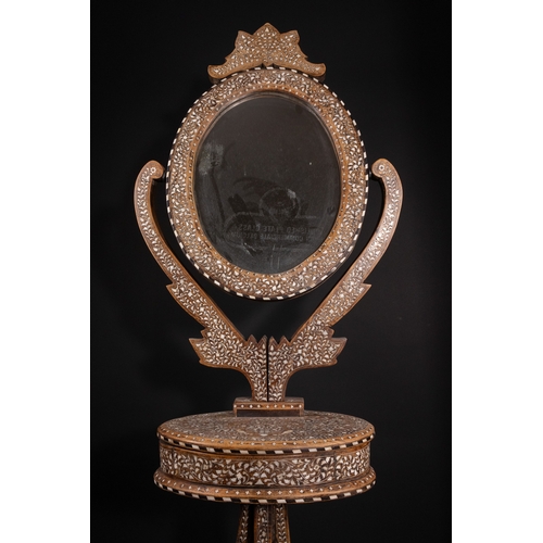 74 - An Indian Wood and Bone Inlaid Dressing Mirror on Stand, 20th Century.

A 20th century Indian carved... 