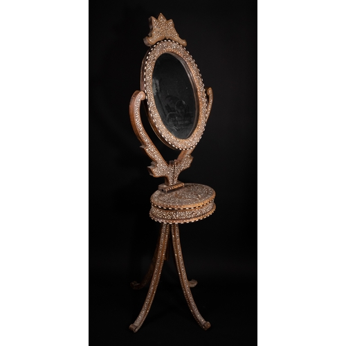 74 - An Indian Wood and Bone Inlaid Dressing Mirror on Stand, 20th Century.

A 20th century Indian carved... 