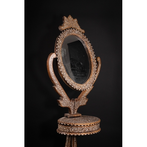 74 - An Indian Wood and Bone Inlaid Dressing Mirror on Stand, 20th Century.

A 20th century Indian carved... 