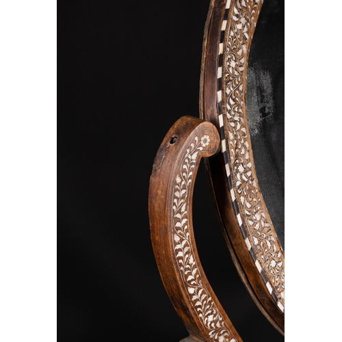 74 - An Indian Wood and Bone Inlaid Dressing Mirror on Stand, 20th Century.

A 20th century Indian carved... 