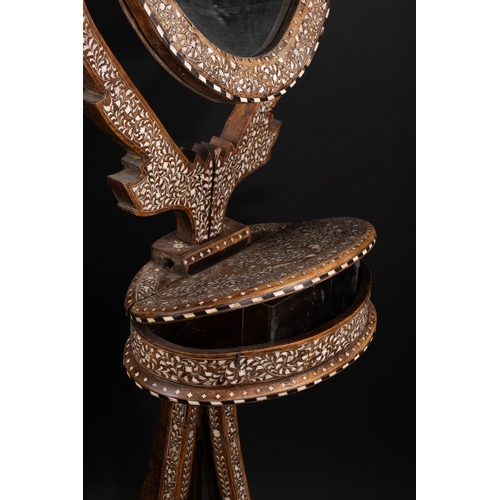 74 - An Indian Wood and Bone Inlaid Dressing Mirror on Stand, 20th Century.

A 20th century Indian carved... 