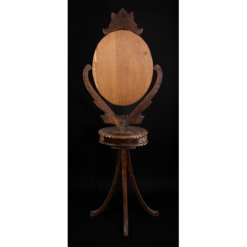 74 - An Indian Wood and Bone Inlaid Dressing Mirror on Stand, 20th Century.

A 20th century Indian carved... 