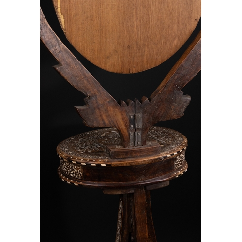 74 - An Indian Wood and Bone Inlaid Dressing Mirror on Stand, 20th Century.

A 20th century Indian carved... 