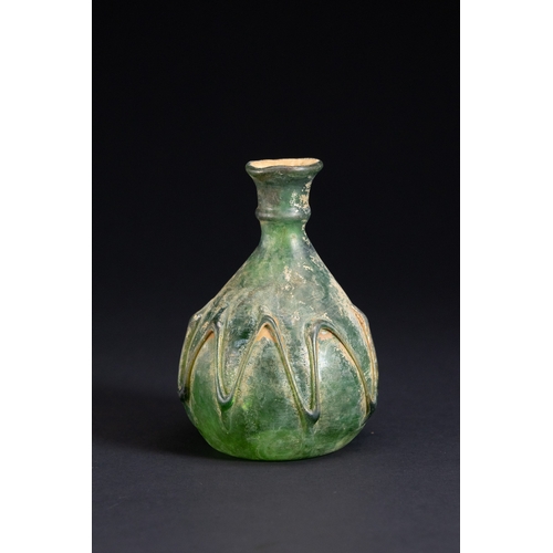 6 - A Roman Green Glass Flask with Trailed Decoration, Circa 1st–3rd Century AD.

Free-blown glass vesse... 