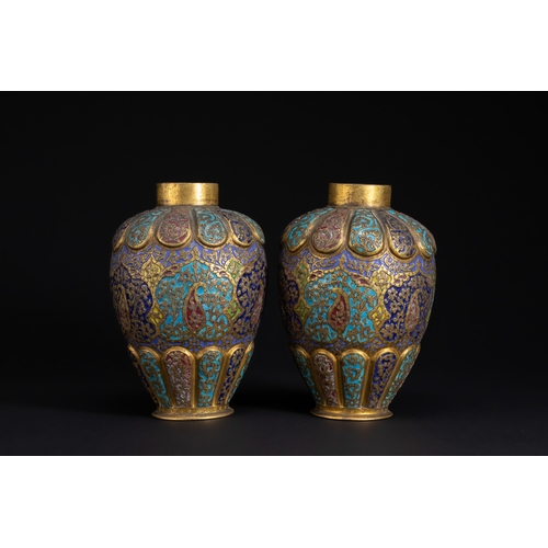 77 - A Pair of Kashmiri Enamelled Brass Vases, 19th Century.

A finely matched pair of Kashmiri brass vas... 