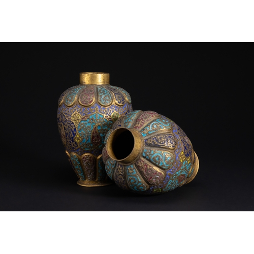 77 - A Pair of Kashmiri Enamelled Brass Vases, 19th Century.

A finely matched pair of Kashmiri brass vas... 