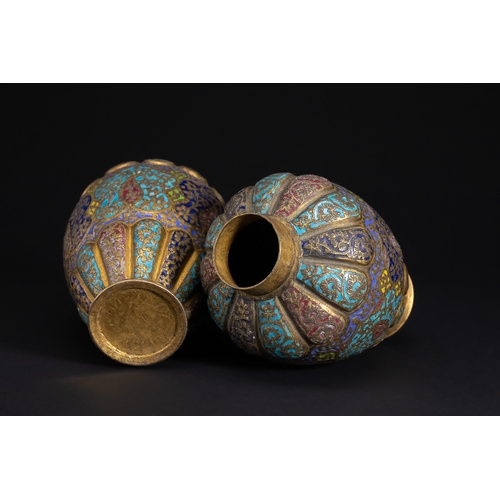 77 - A Pair of Kashmiri Enamelled Brass Vases, 19th Century.

A finely matched pair of Kashmiri brass vas... 