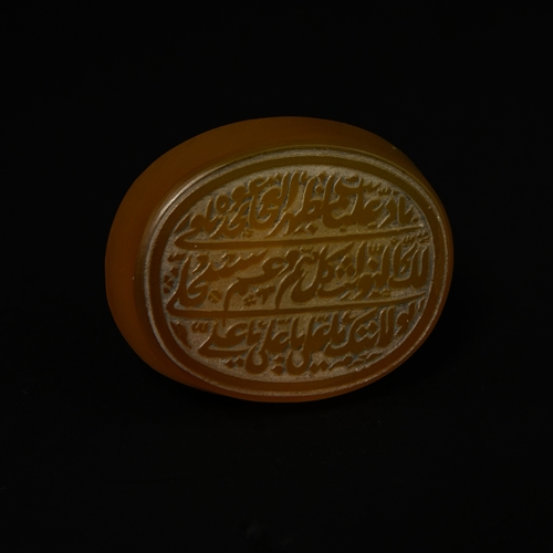 202 - An Islamic Carved Carnelian Agate Seal Stone with Arabic Calligraphy.

An oval Islamic seal carved f... 