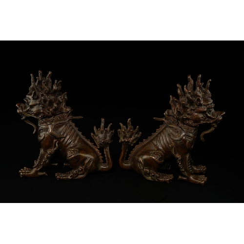 382 - A Pair of Chinese Bronze Guardian Lions (Foo Dogs).

A finely cast pair of Chinese bronze guardian l... 