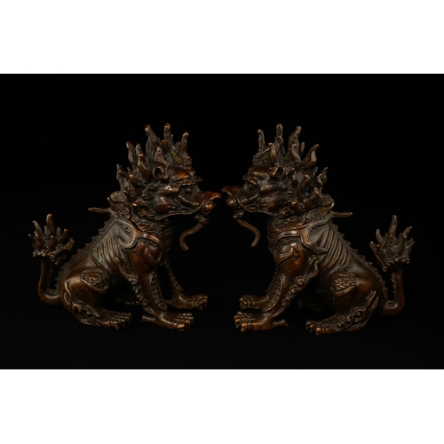 382 - A Pair of Chinese Bronze Guardian Lions (Foo Dogs).

A finely cast pair of Chinese bronze guardian l... 