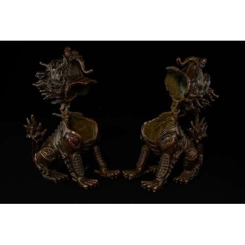 382 - A Pair of Chinese Bronze Guardian Lions (Foo Dogs).

A finely cast pair of Chinese bronze guardian l... 