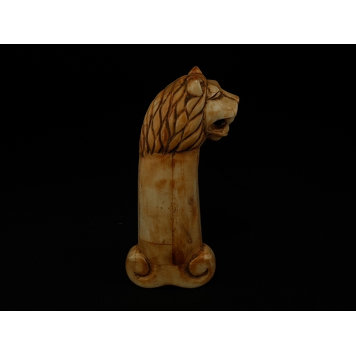 90 - A Mughal Carved Bone Dagger Handle with Lion-Head Terminal.

The handle is carved from pale bone and... 