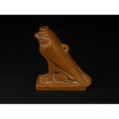 12 - An Egyptian Stone Figure of Horus as a Falcon, Late Period–Ptolemaic Period Circa 664–30 B.C..

Carv... 