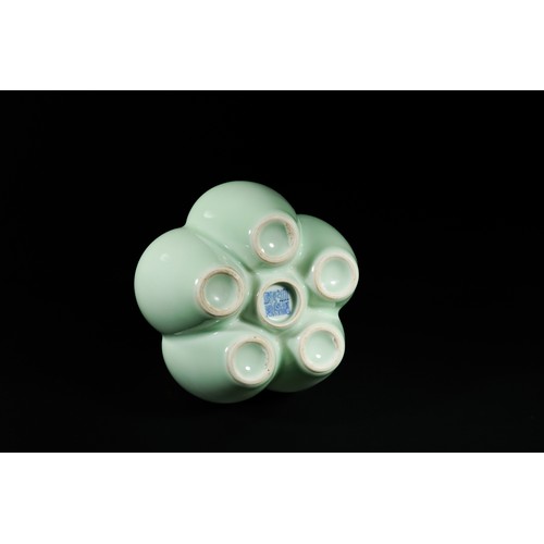 329 - A Chinese Celadon-Glazed Six-Neck Vase, Qianlong Mark.

A pale celadon-glazed vase formed as six joi... 