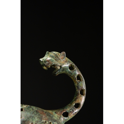 10 - A Khorassan Style Openwork Bronze Zoomorphic Figure.

The figure is cast in bronze, modelled as a st... 
