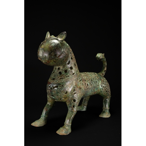 10 - A Khorassan Style Openwork Bronze Zoomorphic Figure.

The figure is cast in bronze, modelled as a st... 