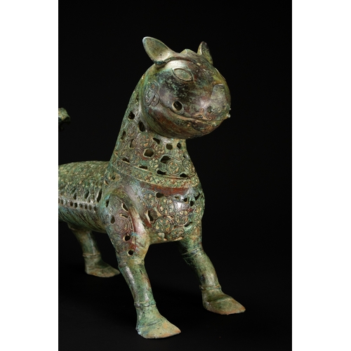 10 - A Khorassan Style Openwork Bronze Zoomorphic Figure.

The figure is cast in bronze, modelled as a st... 