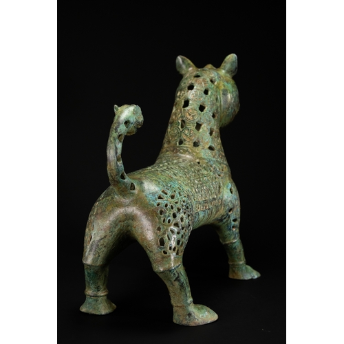 10 - A Khorassan Style Openwork Bronze Zoomorphic Figure.

The figure is cast in bronze, modelled as a st... 