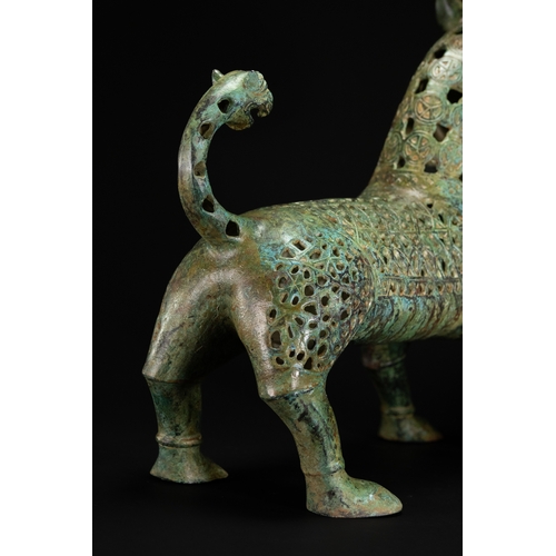 10 - A Khorassan Style Openwork Bronze Zoomorphic Figure.

The figure is cast in bronze, modelled as a st... 