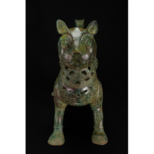 10 - A Khorassan Style Openwork Bronze Zoomorphic Figure.

The figure is cast in bronze, modelled as a st... 