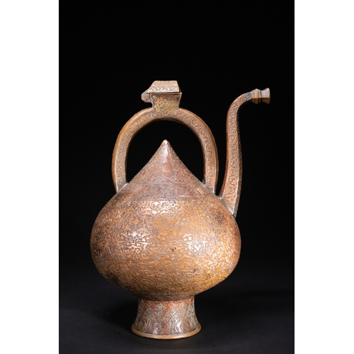 12 - An Islamic Copper Ewer with Incised Scrollwork, 19th Century.

An Islamic copper ewer featuring a bu... 