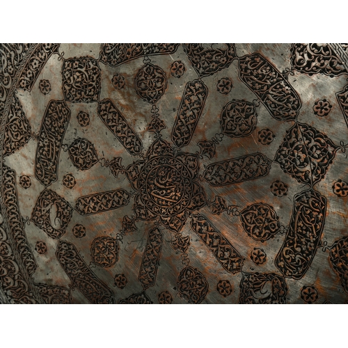 18 - Mohammad Yazdi: A Safavid Copper Tray with Calligraphic and Floral Decoration, 17th Century.

Of cir... 