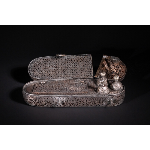 13 - A Safavid Openwork Copper Qalamdan Pen Box with Qur’anic Inscriptions, 17th Century.

An elongated S... 