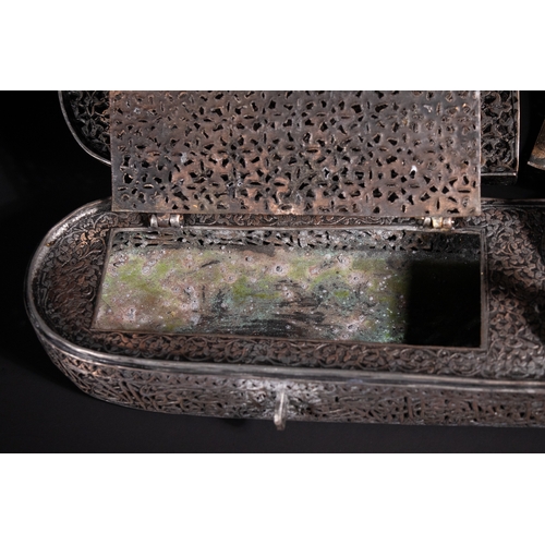 13 - A Safavid Openwork Copper Qalamdan Pen Box with Qur’anic Inscriptions, 17th Century.

An elongated S... 