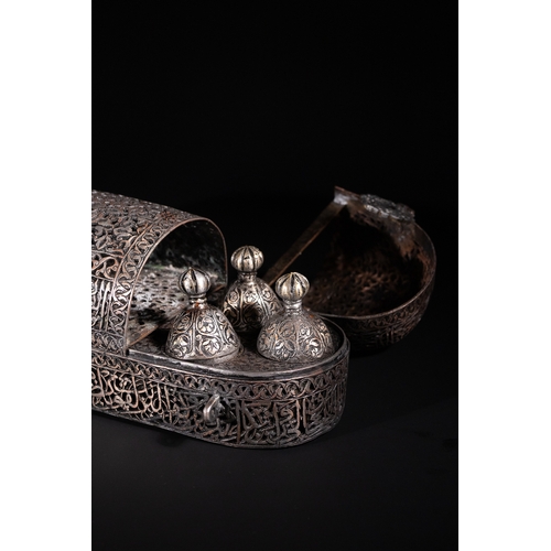 13 - A Safavid Openwork Copper Qalamdan Pen Box with Qur’anic Inscriptions, 17th Century.

An elongated S... 