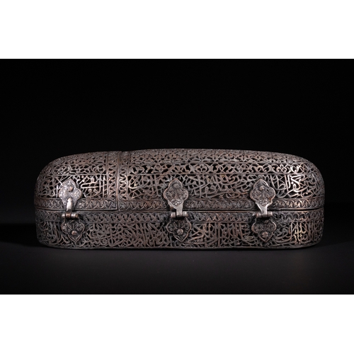 13 - A Safavid Openwork Copper Qalamdan Pen Box with Qur’anic Inscriptions, 17th Century.

An elongated S... 