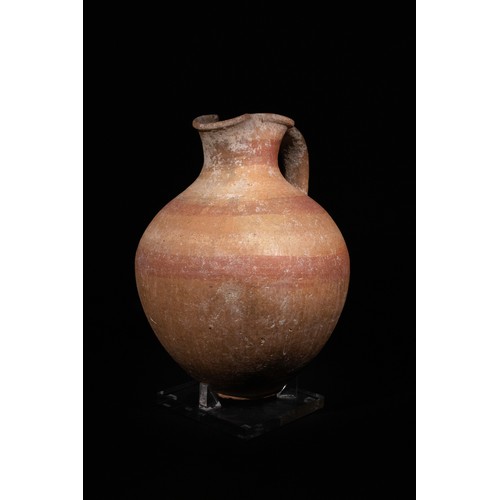 1 - An Eastern Greek Terracotta Jug, 4th-5th Century B.C., with Trefoil Shaped Sprout.

The jug is craft... 