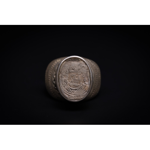 2 - A Sassanian Silver Coin Ring, Possibly Circa 3rd–7th Century AD.

The ring is formed in silver with ... 