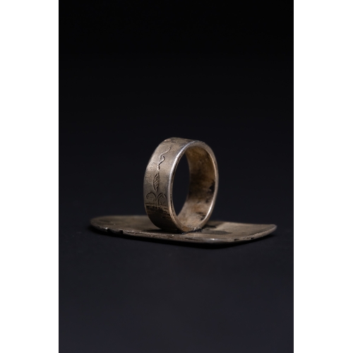 26 - A Tuareg Tribal Berber Silver Talismanic Ring.

The ring is crafted in silver, featuring a large, re... 