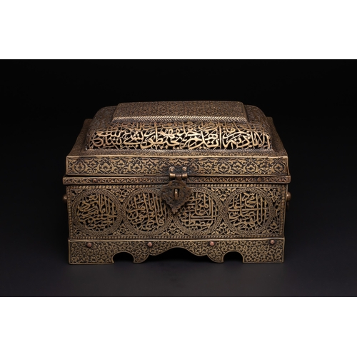 28 - A Qajar Brass Pierced and Engraved Lidded Qur'an Holder with Calligraphic Panels.

The box is of rec... 
