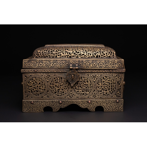 28 - A Qajar Brass Pierced and Engraved Lidded Qur'an Holder with Calligraphic Panels.

The box is of rec... 