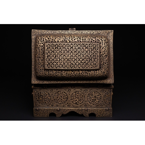 28 - A Qajar Brass Pierced and Engraved Lidded Qur'an Holder with Calligraphic Panels.

The box is of rec... 