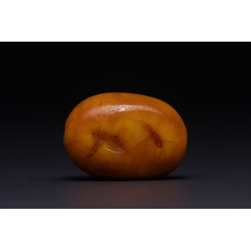 32 - A Butterscotch Amber Barrel Bead with Natural Inclusions.

A single rounded barrel-form amber bead o... 