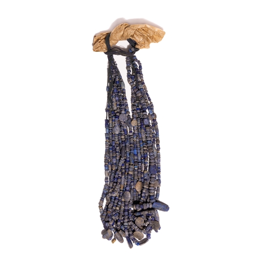 3 - A Bactrian Multi-Strand Lapis Lazuli Bead Necklace.

The necklace is composed of approximately twelv... 