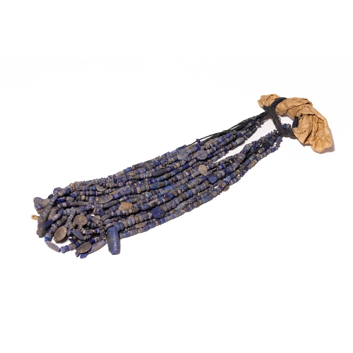 3 - A Bactrian Multi-Strand Lapis Lazuli Bead Necklace.

The necklace is composed of approximately twelv... 