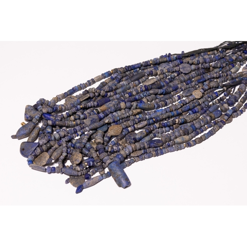 3 - A Bactrian Multi-Strand Lapis Lazuli Bead Necklace.

The necklace is composed of approximately twelv... 