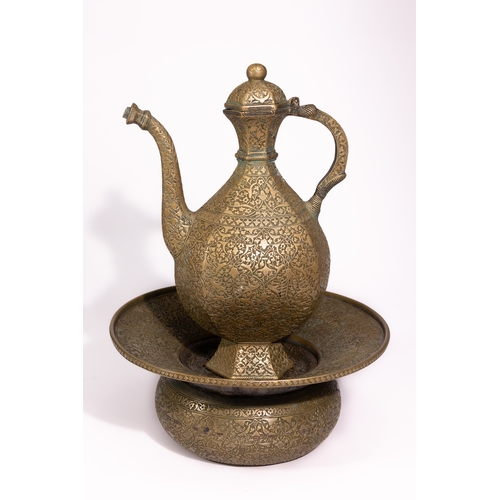 41 - A Persian Brass Ewer and Basin Set with Engraved Decoration.

The set comprises a ewer of bulbous fo... 