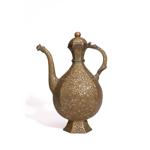 41 - A Persian Brass Ewer and Basin Set with Engraved Decoration.

The set comprises a ewer of bulbous fo... 