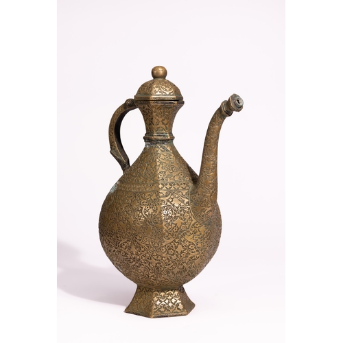 41 - A Persian Brass Ewer and Basin Set with Engraved Decoration.

The set comprises a ewer of bulbous fo... 