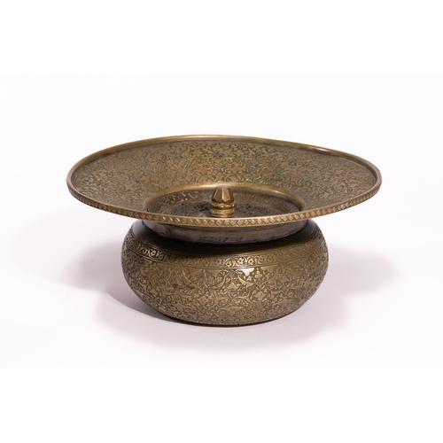 41 - A Persian Brass Ewer and Basin Set with Engraved Decoration.

The set comprises a ewer of bulbous fo... 
