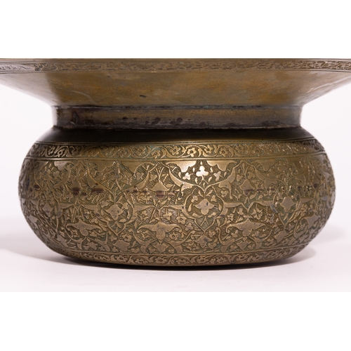 41 - A Persian Brass Ewer and Basin Set with Engraved Decoration.

The set comprises a ewer of bulbous fo... 