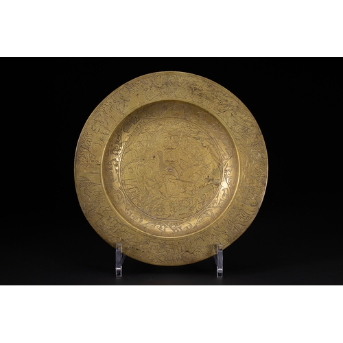 43 - A Qajar Brass Charger Dish with Figural Hunting Scene, 19th-20th Century.

A circular Qajar brass ch... 